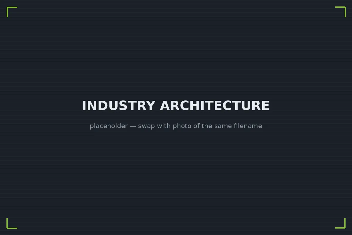 Crisp white SLA printed architectural scale model of a mixed-use building on a studio desk